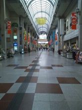 出張 in …