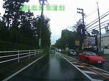 雨の中C5 Corvetteとすれ違った